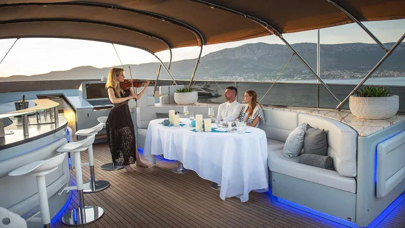  Yacht Photos Pics Luxury yacht Admiral 36, 2007 model, with elegant dining and live violin music on deck.