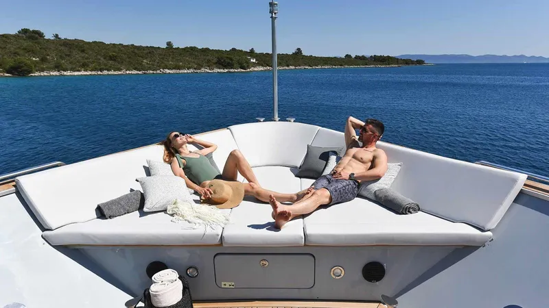  Yacht Photos Pics Couple relaxing on Admiral 36 yacht, 2007 model, enjoying sunny day at sea.