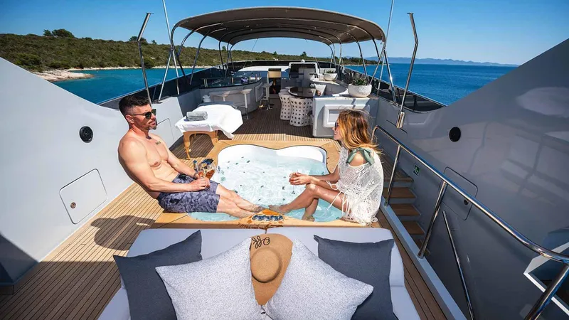  Yacht Photos Pics Couple relaxing in jacuzzi on Admiral 36 yacht, 2007 model, with ocean view.