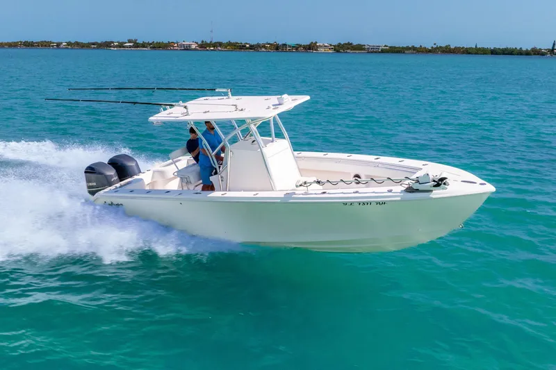  Yacht Photos Pics 2012 SeaHunter 29 boat cruising on clear blue water, featuring dual outboard engines.