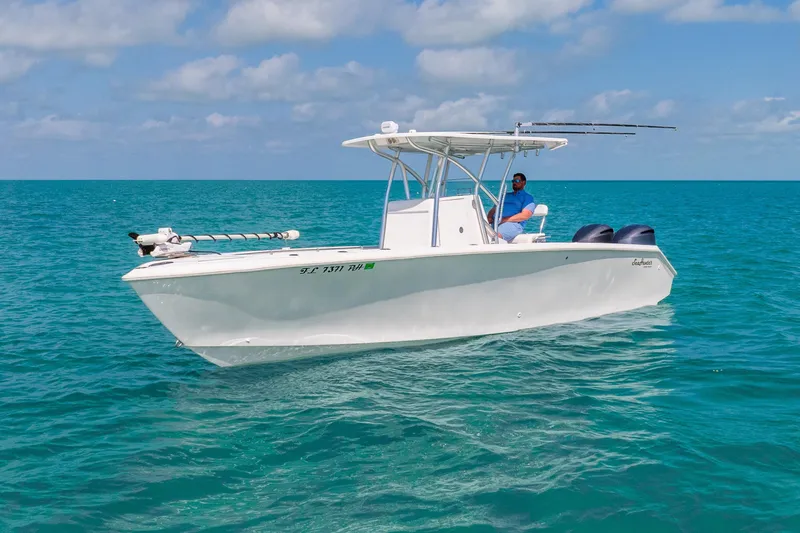  Yacht Photos Pics 2012 SeaHunter 29 boat on clear blue ocean, sunny day, person onboard.