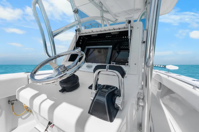  Yacht Photos Pics 2012 SeaHunter 29 boat helm with steering wheel and controls, ocean view.