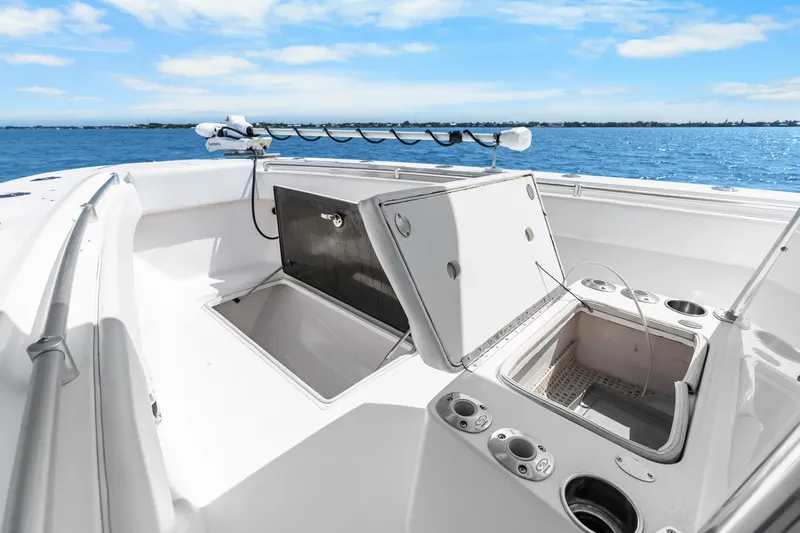  Yacht Photos Pics 2012 SeaHunter 29 boat deck with open storage compartments, rod holders, and ocean view.