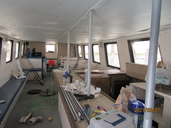 Atlantis Yacht Photos Pics Interior of 1986 Drift Fishing Party boat, showing seating and equipment.