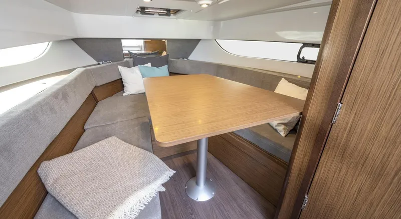  Yacht Photos Pics Interior of 2023 Beneteau Flyer 9 SUNdeck with dining table and seating area.