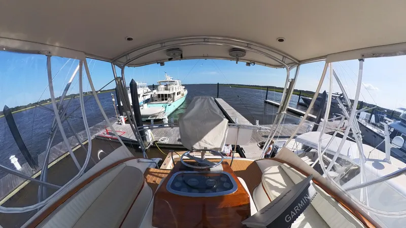  Yacht Photos Pics Interior view of a 1990 Buddy Davis 47 SportFisherman yacht docked at a marina.