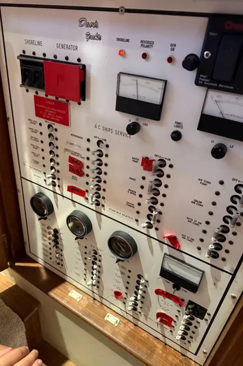  Yacht Photos Pics Control panel of a 1990 Buddy Davis 47 SportFisherman yacht, featuring various switches and gauges.