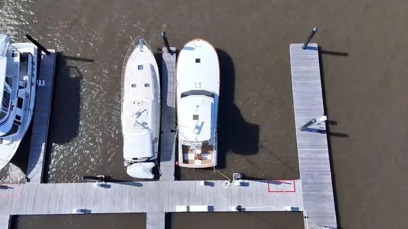  Yacht Photos Pics Aerial view of 1990 Buddy Davis 47 SportFisherman docked at marina.