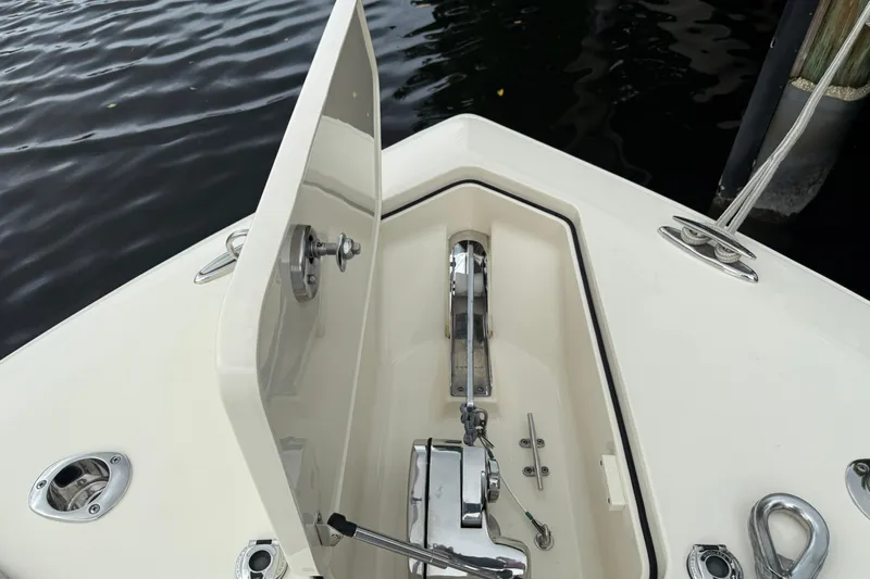 T/t B Happy Yacht Photos Pics 2019 Scout 320 LXF boat anchor compartment with open hatch, dockside view.