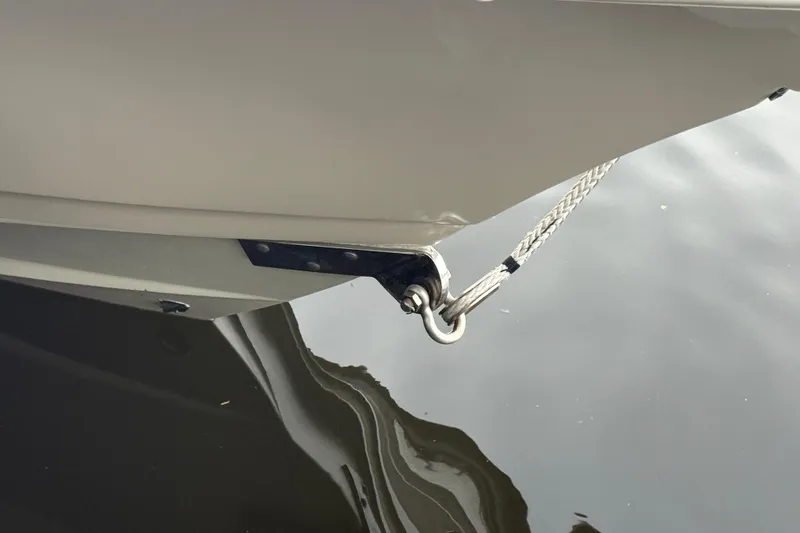 T/t B Happy Yacht Photos Pics Close-up of 2019 Scout 320 LXF boat bow with rope and water reflection.