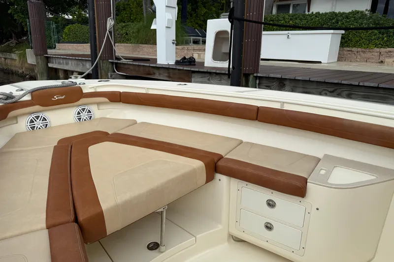 T/t B Happy Yacht Photos Pics 2019 Scout 320 LXF boat interior with tan and brown seating, docked at marina.