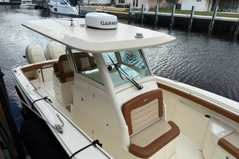 T/t B Happy Yacht Photos Pics 2019 Scout 320 LXF boat docked, featuring Garmin equipment and dual engines.