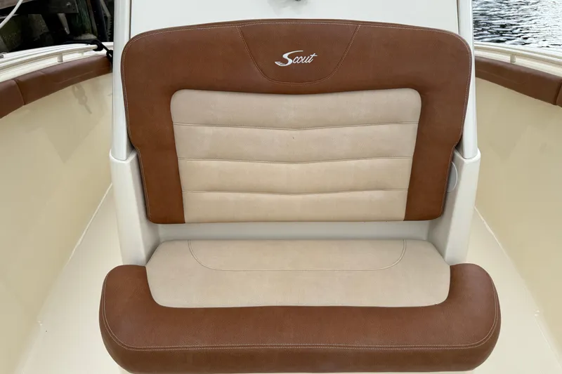 T/t B Happy Yacht Photos Pics Brown and beige seat on 2019 Scout 320 LXF boat, featuring logo embroidery.