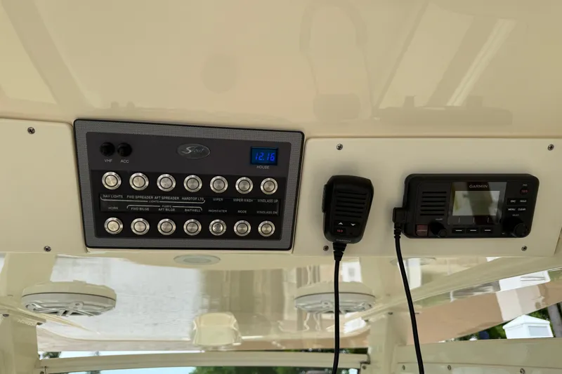 T/t B Happy Yacht Photos Pics Control panel of a 2019 Scout 320 LXF boat with switches and Garmin device.