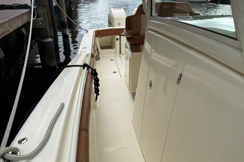 T/t B Happy Yacht Photos Pics 2019 Scout 320 LXF boat interior with sleek design and comfortable seating.