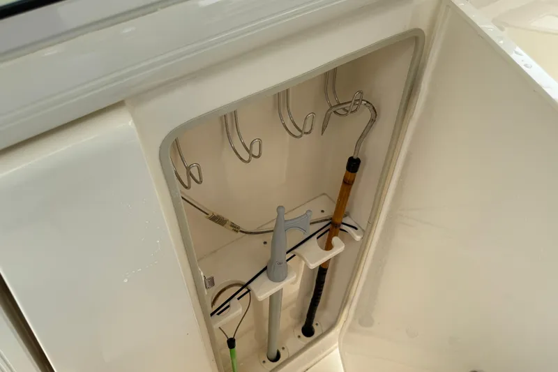 T/t B Happy Yacht Photos Pics Storage compartment with hooks and tools on a 2019 Scout 320 LXF boat.