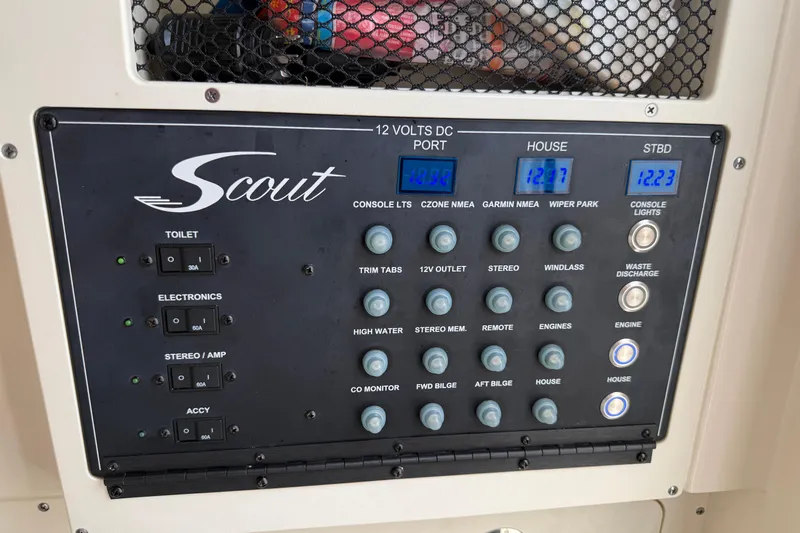 T/t B Happy Yacht Photos Pics Control panel of a 2019 Scout 320 LXF boat with various switches and digital displays.