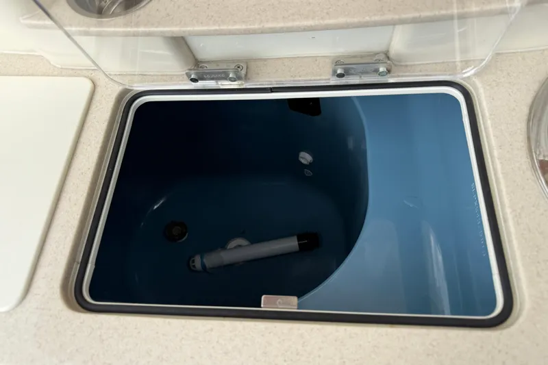 T/t B Happy Yacht Photos Pics Livewell compartment on a 2019 Scout 320 LXF boat, featuring a blue interior.