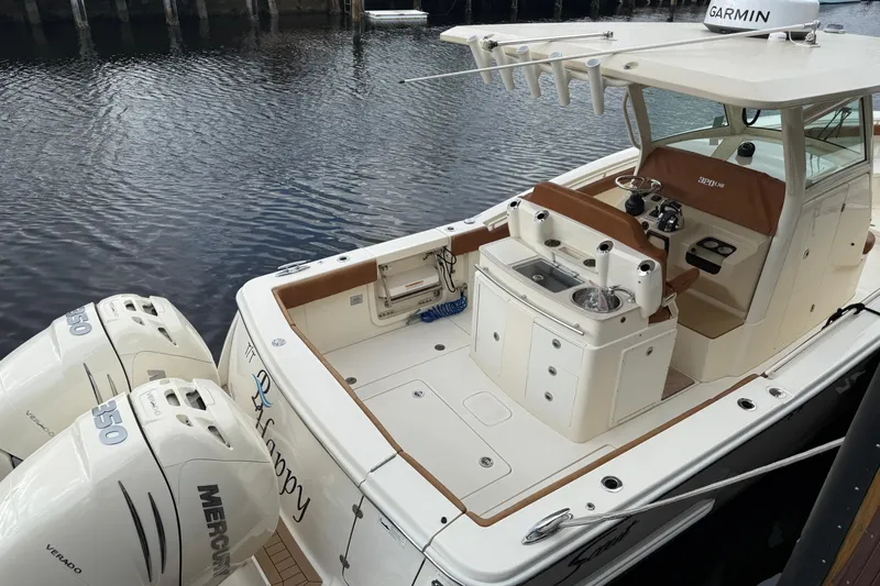 T/t B Happy Yacht Photos Pics 2019 Scout 320 LXF boat with twin Mercury engines docked on calm water.