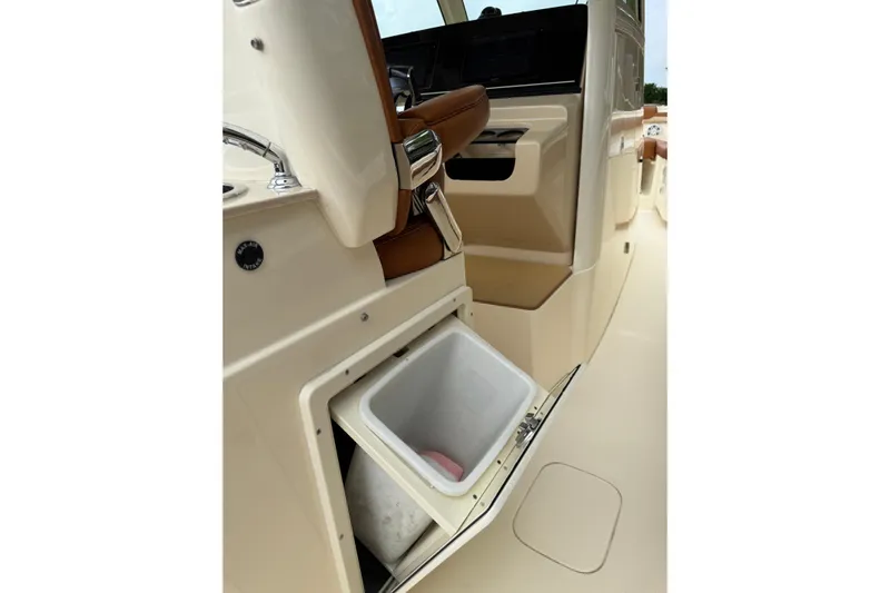T/t B Happy Yacht Photos Pics 2019 Scout 320 LXF boat interior with open storage compartment.
