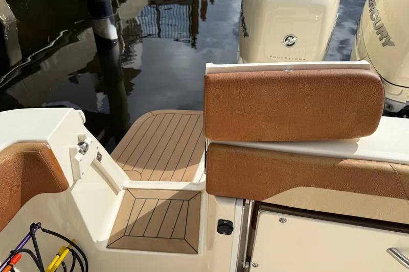 T/t B Happy Yacht Photos Pics 2019 Scout 320 LXF boat interior with brown leather seating and wood flooring.