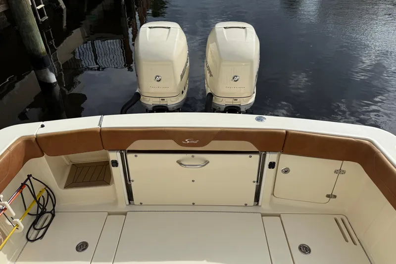 T/t B Happy Yacht Photos Pics 2019 Scout 320 LXF boat with twin outboard engines on calm water.