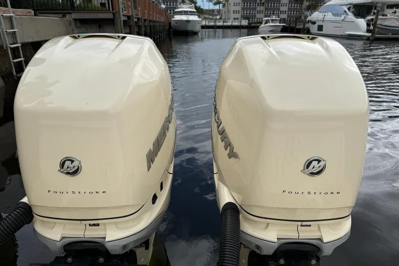 T/t B Happy Yacht Photos Pics Twin Mercury FourStroke engines on a 2019 Scout 320 LXF boat in a marina.