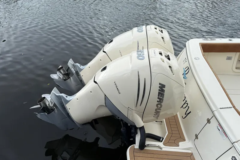 T/t B Happy Yacht Photos Pics 2019 Scout 320 LXF boat with twin Mercury Verado outboard engines on water.