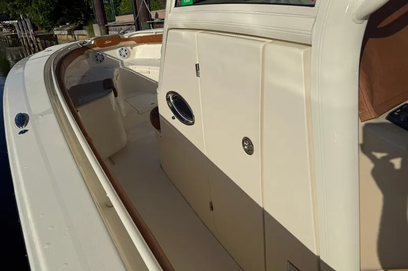 T/t B Happy Yacht Photos Pics 2019 Scout 320 LXF boat interior with seating and storage compartments.