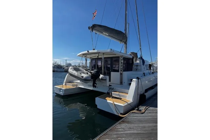 Yacht Photos Pics 2017 Bali 4.0 catamaran docked at marina with inflatable boat on deck.