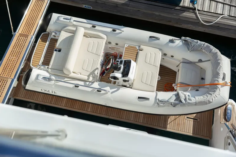 Solstice Yacht Photos Pics Top view of a 2020 Azimut 72 Flybridge yacht with inflatable tender docked.
