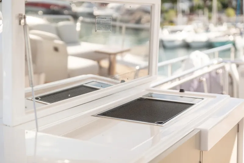 Solstice Yacht Photos Pics Outdoor grill on 2020 Azimut 72 Flybridge yacht, docked with marina view.