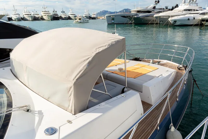 Solstice Yacht Photos Pics 2020 Azimut 72 Flybridge yacht docked in marina, featuring sun deck and canopy.
