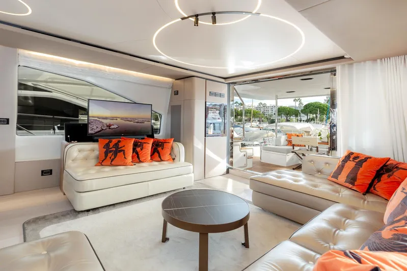 Solstice Yacht Photos Pics Luxurious interior of 2020 Azimut 72 Flybridge yacht with modern decor and vibrant cushions.