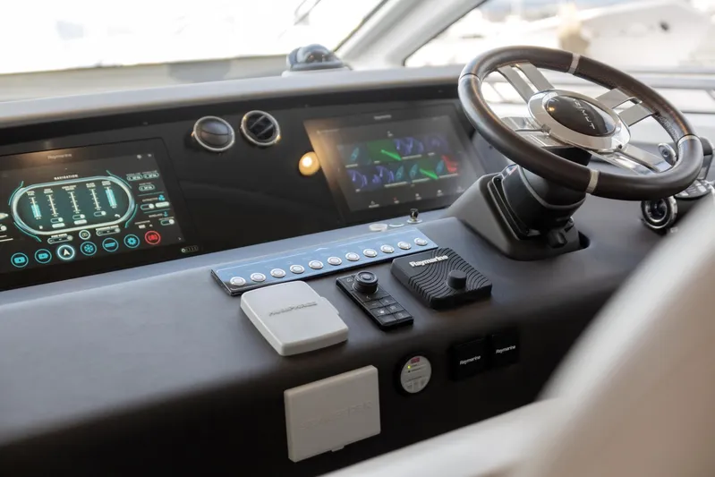 Solstice Yacht Photos Pics Helm of 2020 Azimut 72 Flybridge yacht with modern controls and displays.