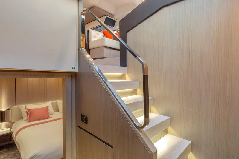 Solstice Yacht Photos Pics Luxurious interior of 2020 Azimut 72 Flybridge yacht with elegant staircase and cozy bedroom.