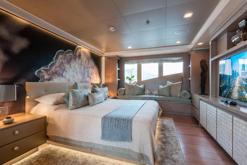 Liberty Yacht Photos Pics Luxurious bedroom on ISA 50M yacht, 2011 model, featuring elegant decor and large windows.