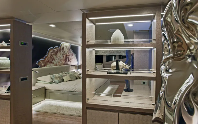 Liberty Yacht Photos Pics Luxurious bedroom interior on ISA 50M yacht, featuring modern decor and ambient lighting.