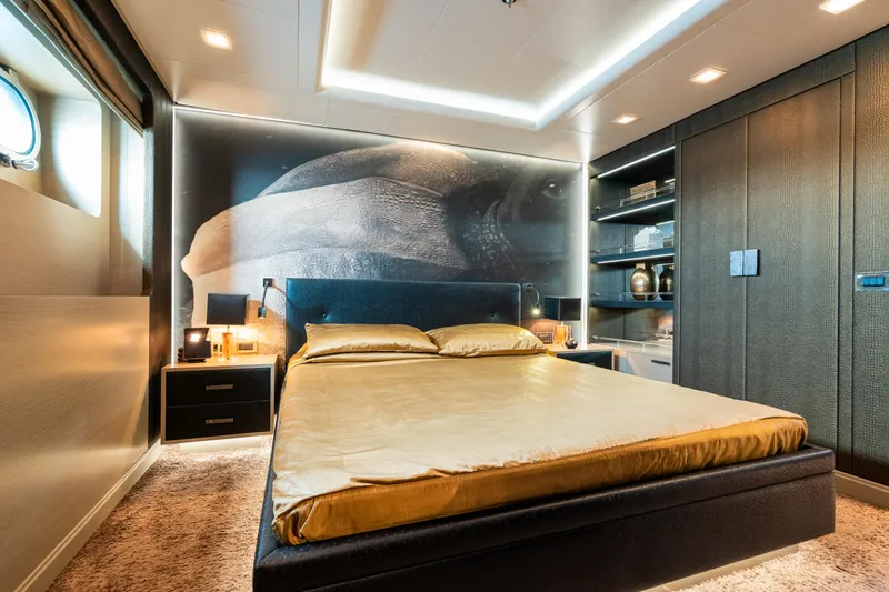 Liberty Yacht Photos Pics Luxurious bedroom on 2011 ISA 50M yacht with modern decor and ambient lighting.
