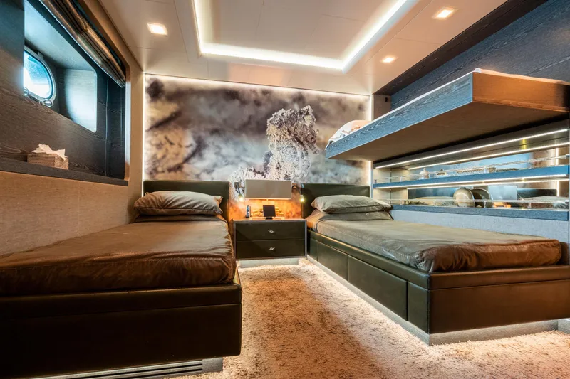 Liberty Yacht Photos Pics Luxurious twin bedroom on 2011 ISA 50M yacht with modern decor and ambient lighting.
