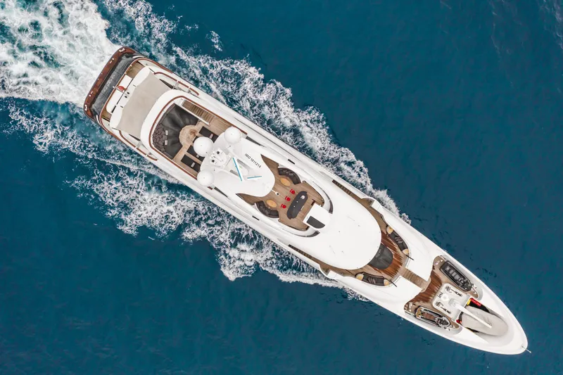 Liberty Yacht Photos Pics Aerial view of 2011 ISA 50M luxury yacht cruising on blue water.