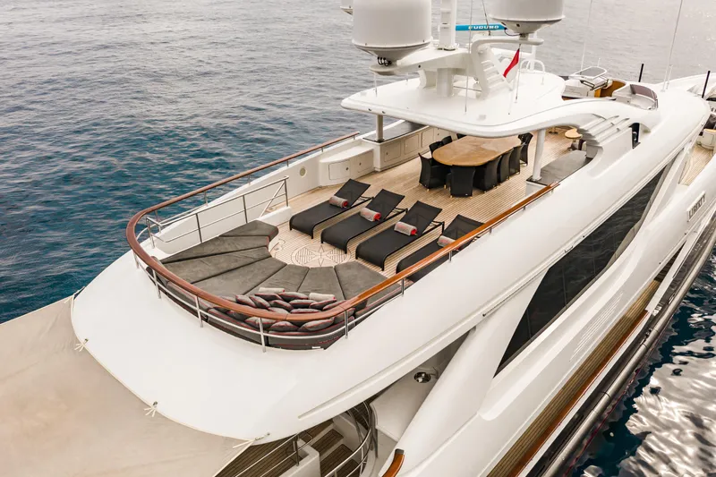 Liberty Yacht Photos Pics Luxury ISA 50M yacht 2011 model with sun loungers and dining area on deck.