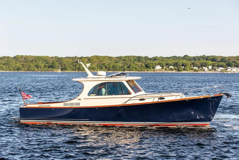 Brendan Yacht Photos Pics 2018 Hinckley Picnic Boat 37 MKIII cruising on a calm lake.