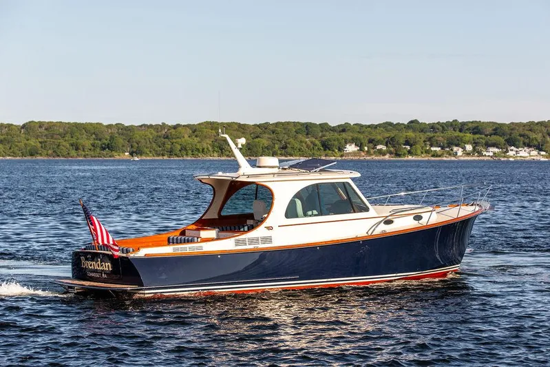 Brendan Yacht Photos Pics 2018 Hinckley Picnic Boat 37 MKIII cruising on a serene lake.