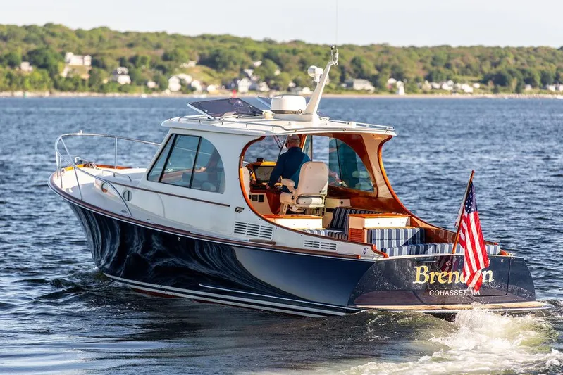 Brendan Yacht Photos Pics 2018 Hinckley Picnic Boat 37 MKIII cruising on water with American flag.