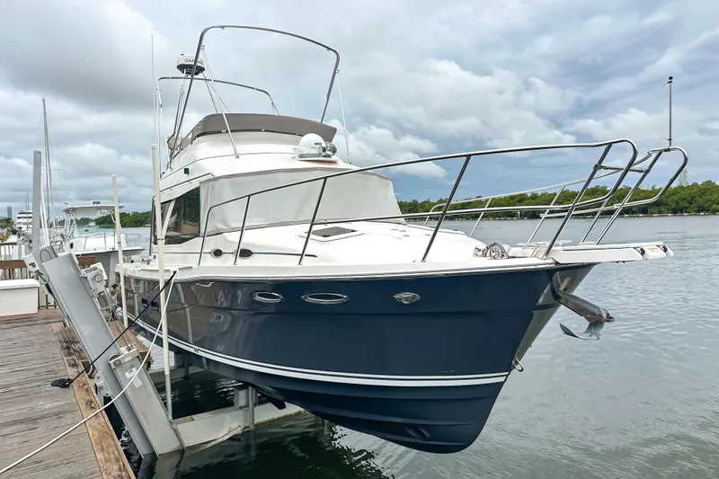  Yacht Photos Pics 2022 Cutwater 30 Command Bridge yacht docked by the water on a cloudy day.