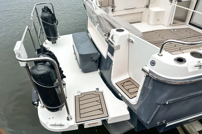  Yacht Photos Pics 2022 Cutwater 30 Command Bridge boat stern with deck and railing details.