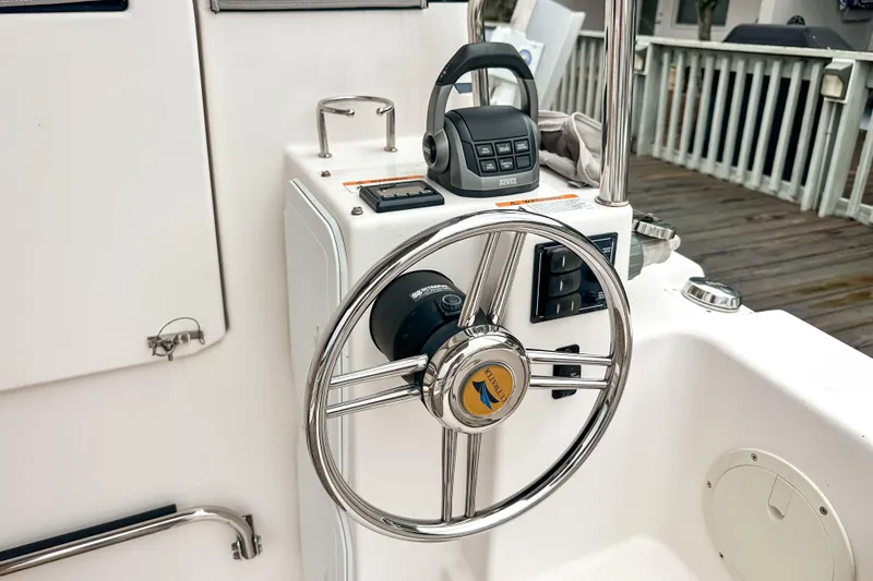  Yacht Photos Pics Steering wheel and controls of 2022 Cutwater 30 Command Bridge boat.