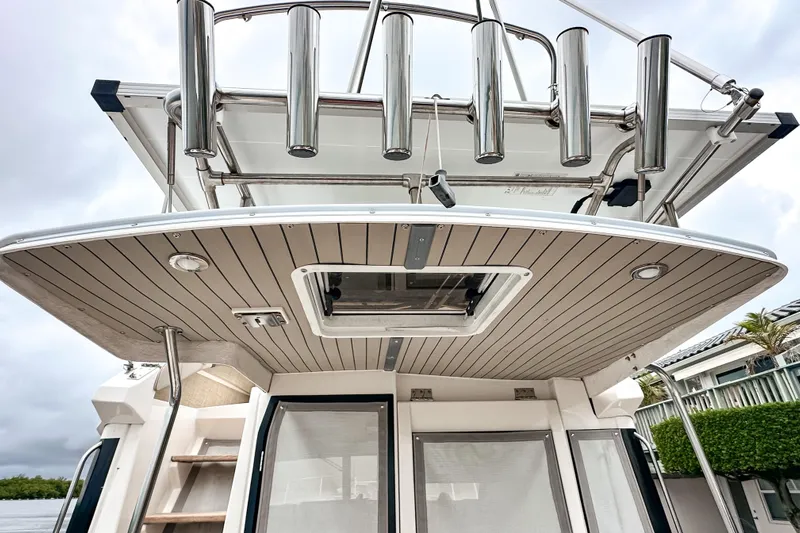  Yacht Photos Pics 2022 Cutwater 30 Command Bridge boat with sleek design and stainless steel features.