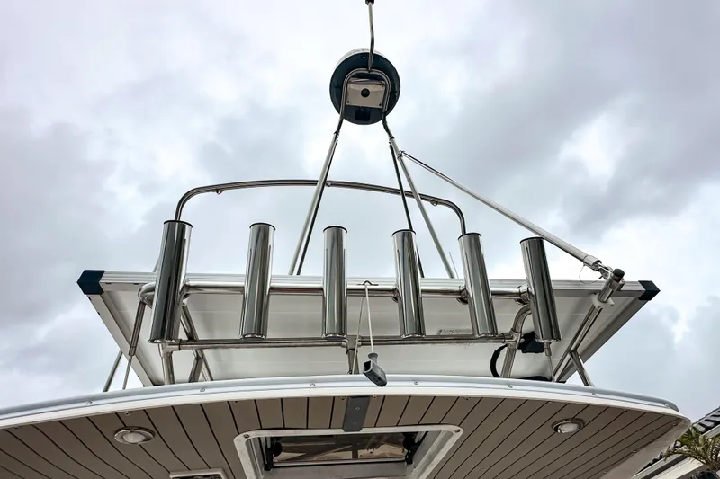  Yacht Photos Pics 2022 Cutwater 30 Command Bridge boat with stainless steel rod holders, viewed from below.
